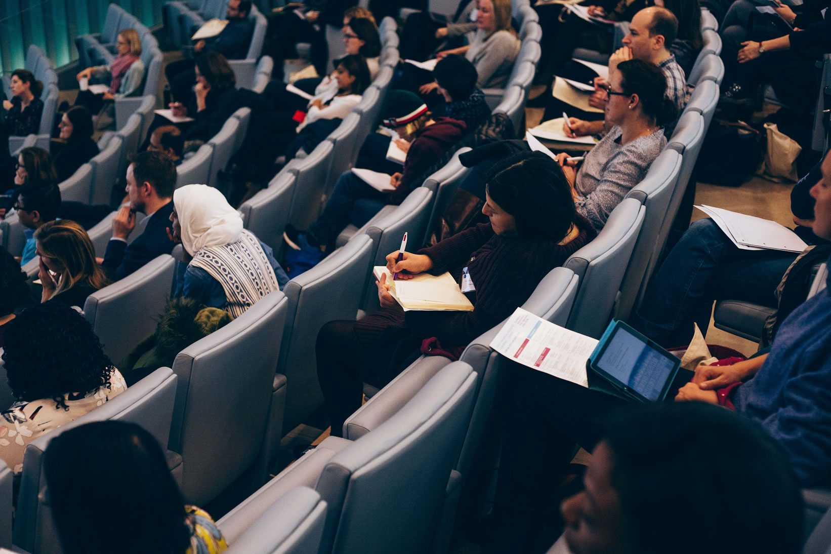 Paediatric professionals engaged in a conference session